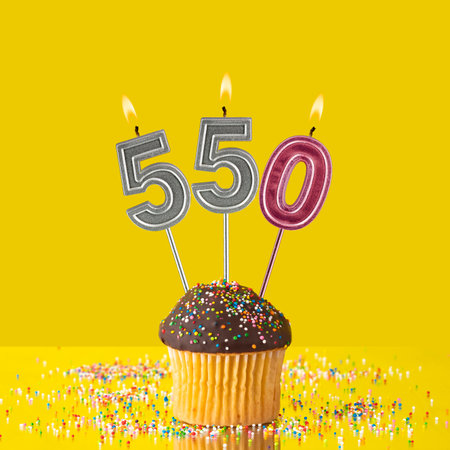 Violet candles forming the number 550.の写真素材