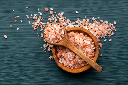 Pure and fine Himalayan salt in bowl and spoon - Pink crystals.の写真素材