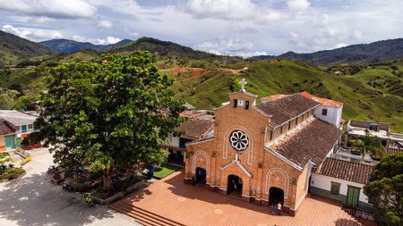 Alexandria, Antioquia - Colombia. November 16, 2025. Panoramic drone view of the town's main church.の写真素材