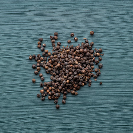 Organic black peppercorns scattered - Piper nigrumの写真素材