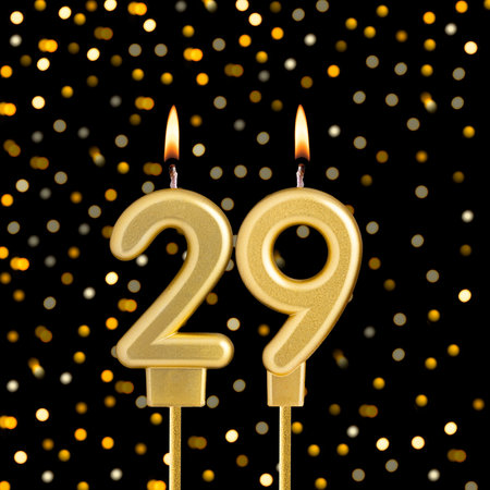 Number 29 on a black background with blurred lights - Birthday card with abstract blurred lights that glowの写真素材