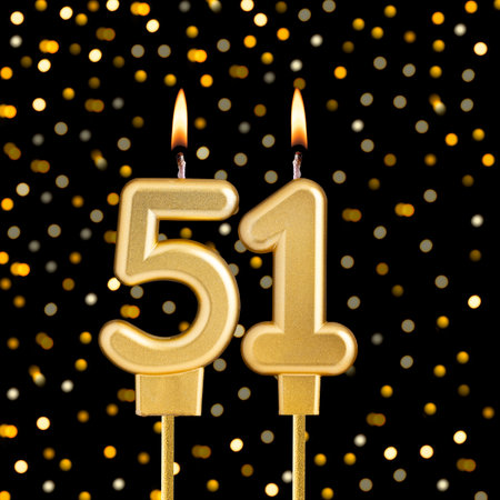 Number 51 on a black background with blurred lights - Birthday card with abstract blurred lights...