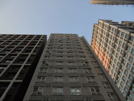 Looking up at city buildings from below