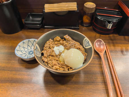 Gyudon with half-boiled egg at a Japanese restaurantの写真素材