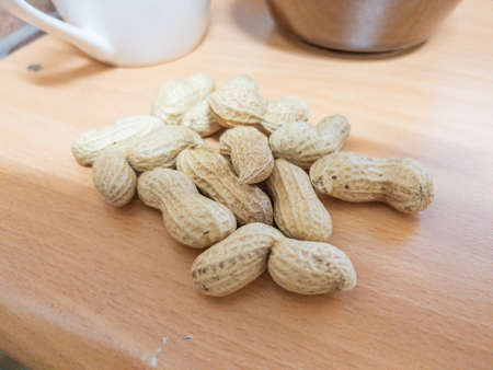 Unpeeled Peanuts on the Desk
