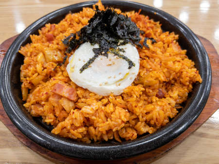 Kimchi Fried Rice topped with Eggの写真素材