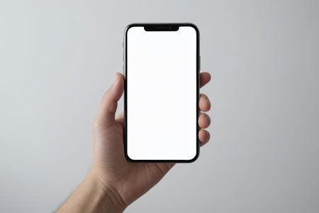 someone holding a black and white iphone in their handの素材