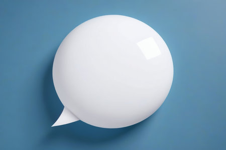 a close up of a white balloon with a speech bubble on a blue backgroundの素材