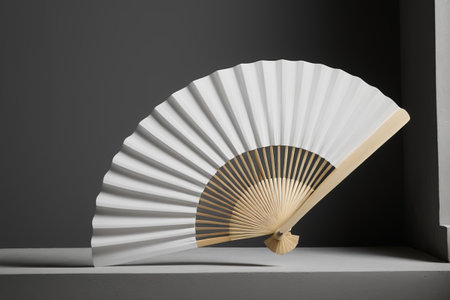Close-up of a still life with a white folding fanの素材