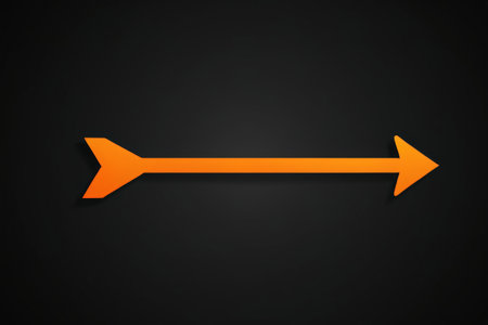 Orange arrow symbol on black backgroundの素材