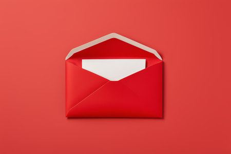 White stationery inside a red envelopeの素材
