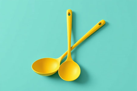 Yellow spoon on blue backgroundの素材
