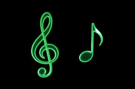 Green music symbol on black backgroundの素材