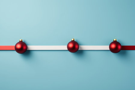 Red Christmas decoration ball on blue backgroundの素材