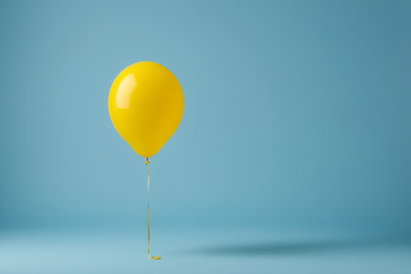 Yellow balloon with blue backgroundの素材