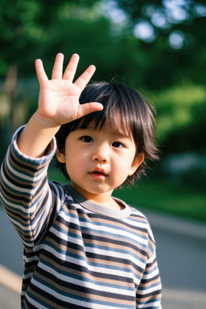 Cute baby outdoors in the sunの素材