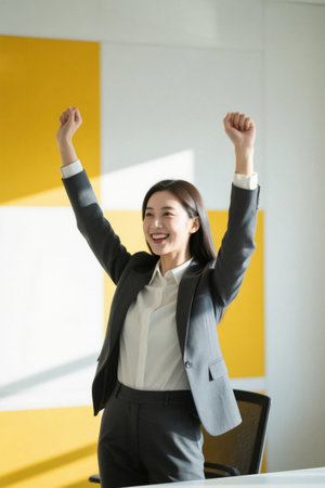 Successful working women celebrate victoryの素材