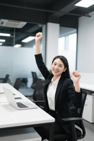 Women in the workplace celebrate their success with joyの素材