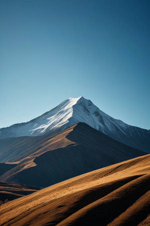 mountains with a snow covered peak in the distanceの素材