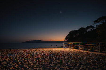 Railings and starry sky views on the beach at nightの素材