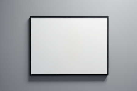 Blank picture frame hanging on a gray wallの素材