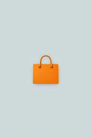 there is a small orange bag with a handle on a blue backgroundの素材