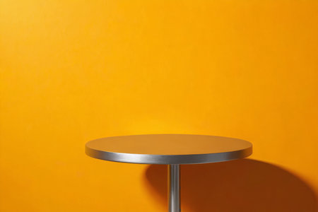 Metal round table on orange backgroundの素材