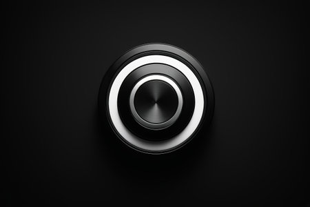 Close-up of round metal button on black backgroundの素材