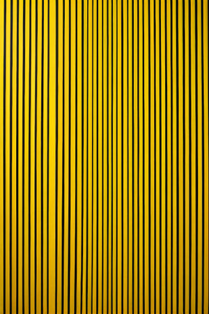 Yellow and black vertical stripes background textureの素材