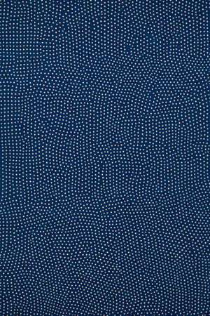 White polka dot texture pattern on blue backgroundの素材