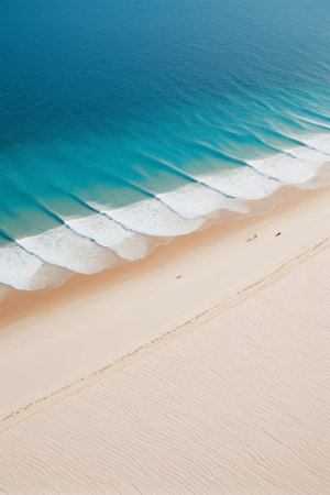 Overlooking the beach with waves and sandの素材