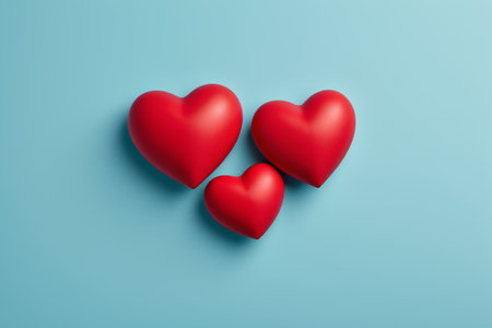 three red hearts on a blue backgroundの素材