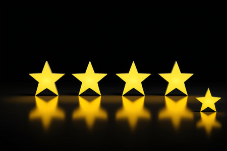 five stars are placed in a row on a black surfaceの素材