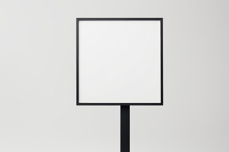 there is a black sign on a black pole with a white backgroundの素材