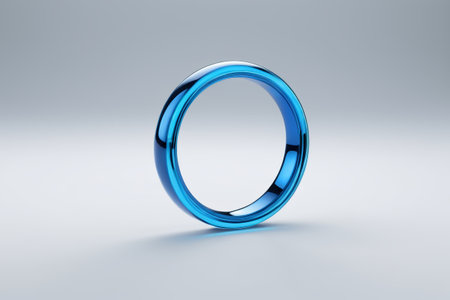 a close up of a blue ring on a white surfaceの素材