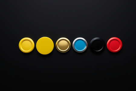 a close up of a row of different colored buttons on a black surfaceの素材