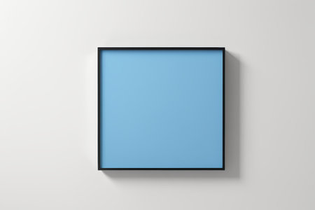 a picture frame hanging on a wall with a blue backgroundの素材