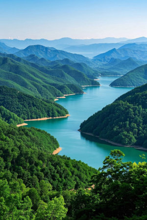 Lake scenery with green mountains and green waterの素材