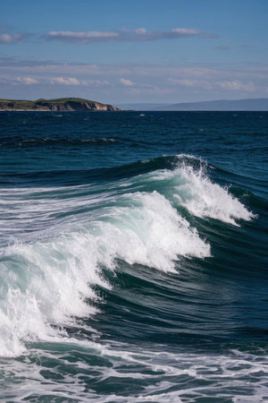 The blue ocean surges with white wavesの素材