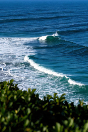 The blue ocean surges with white wavesの素材