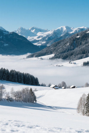 Winter rural scenery under the snow-capped mountainsの素材