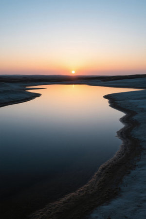 Tranquil water landscape at sunsetの素材