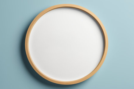Round wooden frame with light blue backgroundの素材