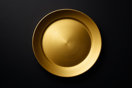Gold disc on black backgroundの素材