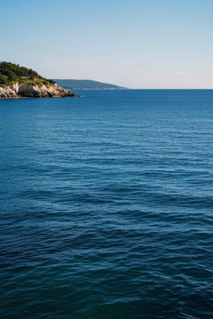 Blue ocean and rocky shore landscapeの素材