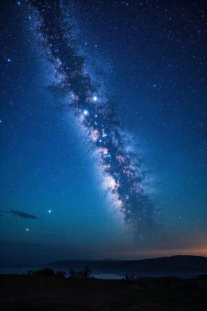 The Milky Way and the distant mountains under the night skyの素材