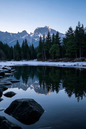Peaceful lakes in the mountains and reflections of snow-capped mountainsの素材
