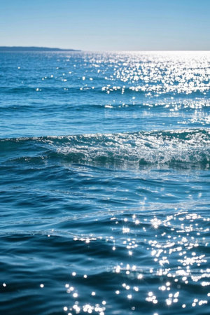 A blue ocean sparkling in the sunの素材