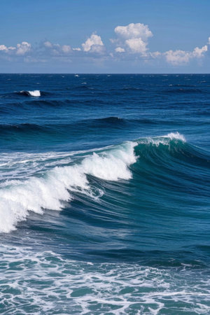 The blue ocean surges with white wavesの素材
