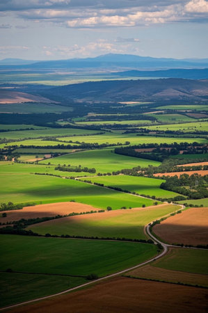 The natural scenery of vast fields and distant mountainsの素材